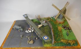 A 1/72nd diorama of a Felixstowe flying boat: with figures and windmill in a naturalistic setting.