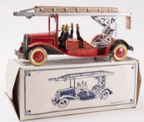 A tinplate clockwork fire engine:, with silver turntable and ladder, red lithograph printed cab,