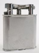 A Dunhill silver plated petrol table lighter:, signed as per title to arm, on an engine milled case,