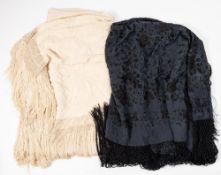 A cream silk shawl with floral embroidered decoration and tassel fringe:,