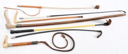 A carved antler carved dog's head handled riding whip:,