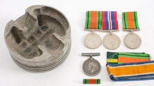 A WWI War medal to '3117 Pte H F Burton Hamps R' :, together with two Defence Medals ,