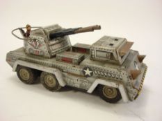 K Toys (Japan) A tinplate friction drive Anti-aircraft gun:, silver lithograph printed body,