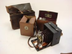 An Eastman Kodak 'Unicum' quarter plate camera:, with mahogany and brass fittings in a black case,