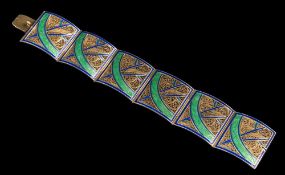 A blue and green enamelled silver filigree panel bracelet: approximately 18.5cm overall length.