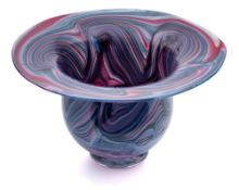 An art glass bowl: of deep 'U' shaped form with flaring rim, the red,