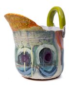 *Linda Styles (Contemporary) a terracotta slab built vessel: of helmet-shaped form with lug handle