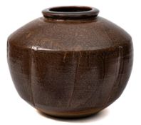 *David Leach (1911-2005) a stoneware jar: of shouldered and lobed form under brown glazes,