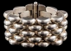 A mid 20th century Continental silver 'Tank' bracelet: with a wide band of polished domed links,