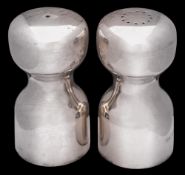 A pair of modernist salt and pepper shakers, maker Robert Welch, London,