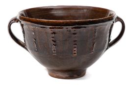 *Michael Cardew (1901-1983) a stoneware bowl: of footed two handled form decorated below the rim