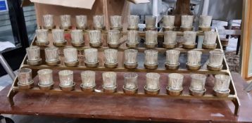 Four-tier votive candle holder comprising 40 candle cups