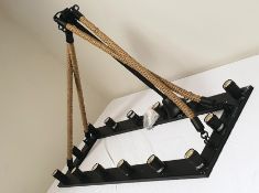 Black metal and rope supported ceiling light with 14 bulbs, length 125cm (VAT payable on hammer)