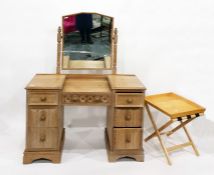 Oak mirror-back dressing table, the central frieze drawer flanked by three short drawers to either s