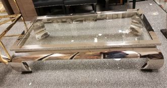 LOT WITHDRAWN Rectangular glass top coffee table with chrome steel frame, raised on short curved