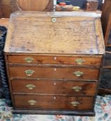 Late 18th century oak bureau, the fall revealing t