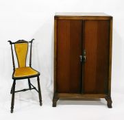 20th century oak cupboard, the interior fitted with shelves, on cabriole legs, width 73cm and a