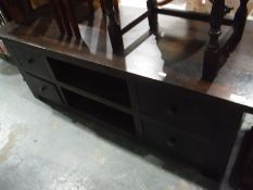 Small coffee table and a low chest of four short drawers and flanking open bookshelves (2)