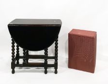 Old oak oval top gateleg table on bobbin turned supports, length 76cm and a Lloyd Loom 'Lusty' cloth