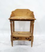 Pair of pine washstands with three-quarter galleried tops above open under-tier with single
