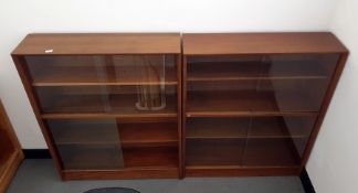 Two teak shelving units with sliding glass doors and one further similar (3)