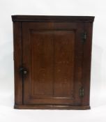 19th century oak wall-hanging corner cupboard with single panelled door enclosing shelves The