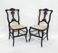 Pair of 19th century bedroom chairs with carved and pierced vase-shaped back splats, stretchered
