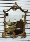 Reproduction gilt wall mirror, rococo style with lion mask decoration