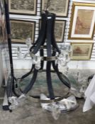 12-light electrolier arranged six over six, finished in stained wood and steel (VAT payable on