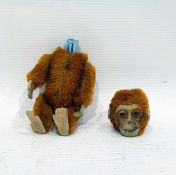 Schuco scent bottle in the form of a monkey, with articulated body and felt hands and feet (interior