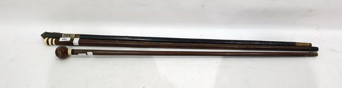 Three various canes to include malacca cane with horn brass and carved bone handle, further cane