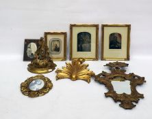 Quantity of early family photographs in gilt moulded frames, further gilt moulded wood shelf,