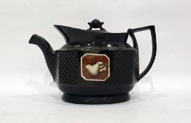 Early 19th century pottery teapot of shaped black glazed oval form, set with agate-effect shell