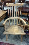 19th century Windsor wheelback elbow chair with outscroll arms, shaped top rail, bowed carver arm