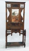 19th century oak hall stand with mirrored back, featuring foliate carvings, coat hooks above the
