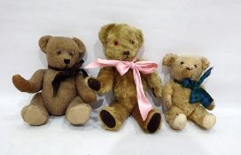 Small gold plush straw stuffed bear with stitched eyes and nose, height 27cm together with a brown