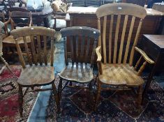 Stickback carver chair on turned front supports, two slatback dining chairs and a spindle back