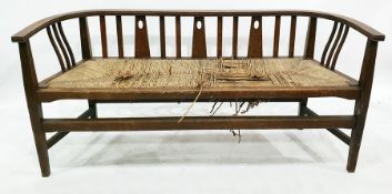 Probably an E. A. Taylor for Wylie and Lochhead, an Arts & Crafts oak settee, the curved back rail