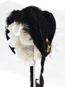 Victorian bonnet in velvet and cotton, trimmed with lace and ostrich feather with a white frill