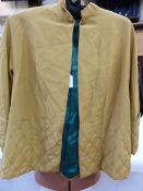 1950's mustard yellow evening jacket with quilted cuffs and deep quilted hem, a cut velvet evening