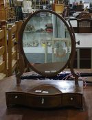 19th century mahogany and banded oval dressing table mirror with serpentine front, three drawers and