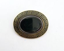 Rolled gold, black enamel and onyx brooch, oval, set single polished oval stone, flat-topped, and