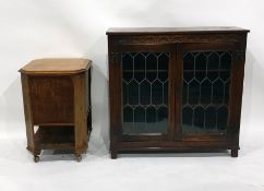 20th century oak bookcase with leaded glazed doors enclosing shelves, to square section supports and