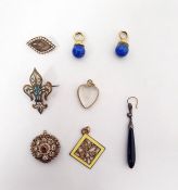 19th century memorial brooch of shaped oval form, the glazed compartment surrounded by border of