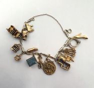 9ct gold fancy link charm bracelet hung with a 1902 gold half-sovereign, in 9ct gold coin mount, ten