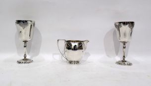 Pair of silver wine goblets, Birmingham 1969, engraved with grapes and vine leaves and a silver milk