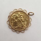 Gold full sovereign dated 1907 in gold-coloured coin mount