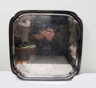 Silver salver by Viners Limited, Sheffield 1962, of shaped square form, on four scroll feet, 30cm