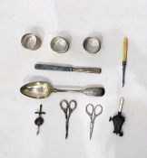 19th century fiddle pattern silver tablepoon, three silver napkin rings, a silver rattle with