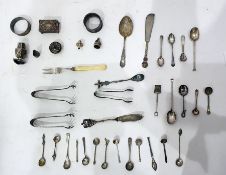 Two silver napkin rings, a silver matchbox holder, assorted silver condiment spoons and various